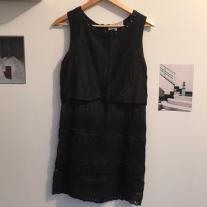 Black silk and lace dress with brass stud details